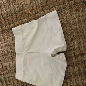 Under armor white shorts/tights. Medium size.